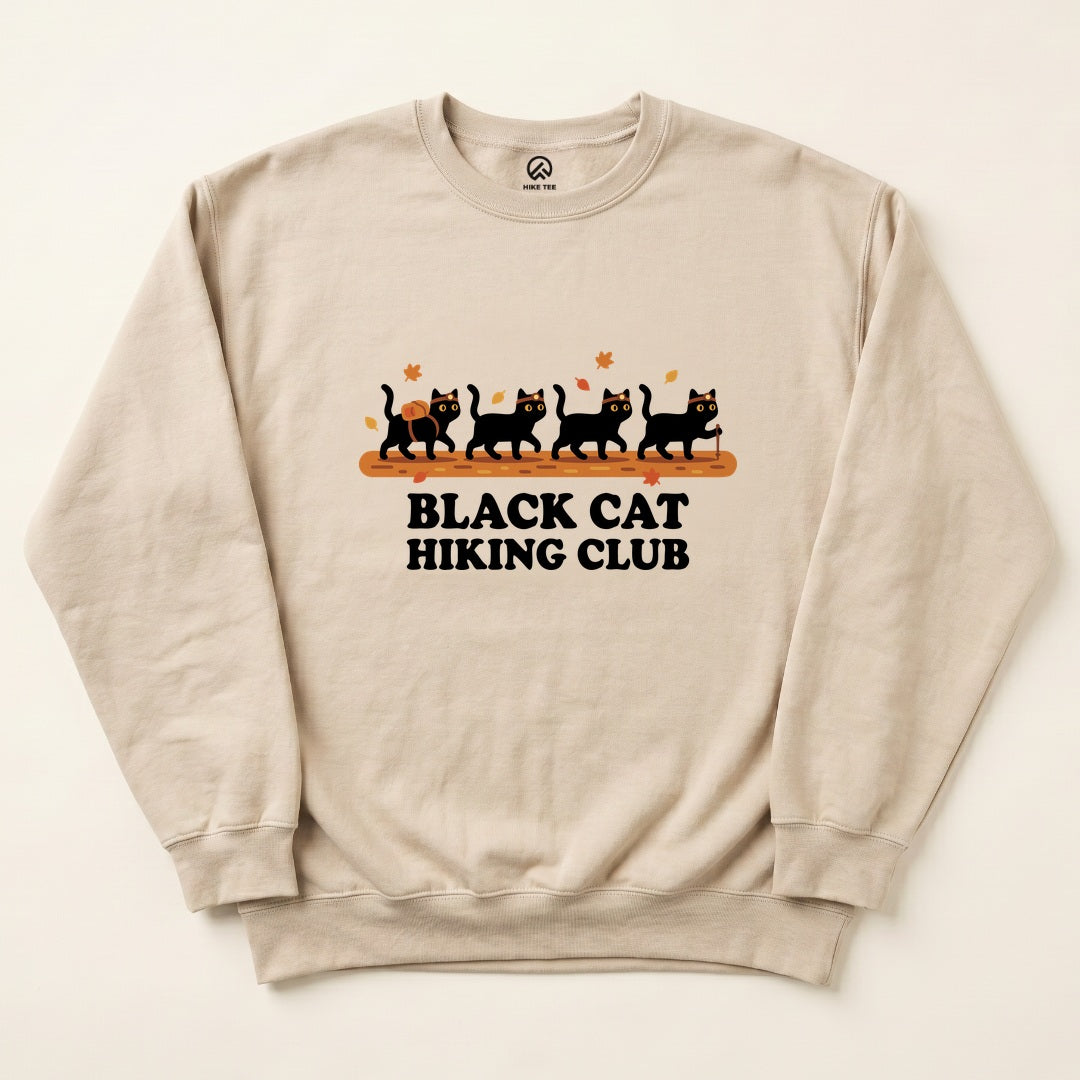 Sand Black Cat Hiking Club Sweatshirt with four black cats hiking on an autumn trail graphic