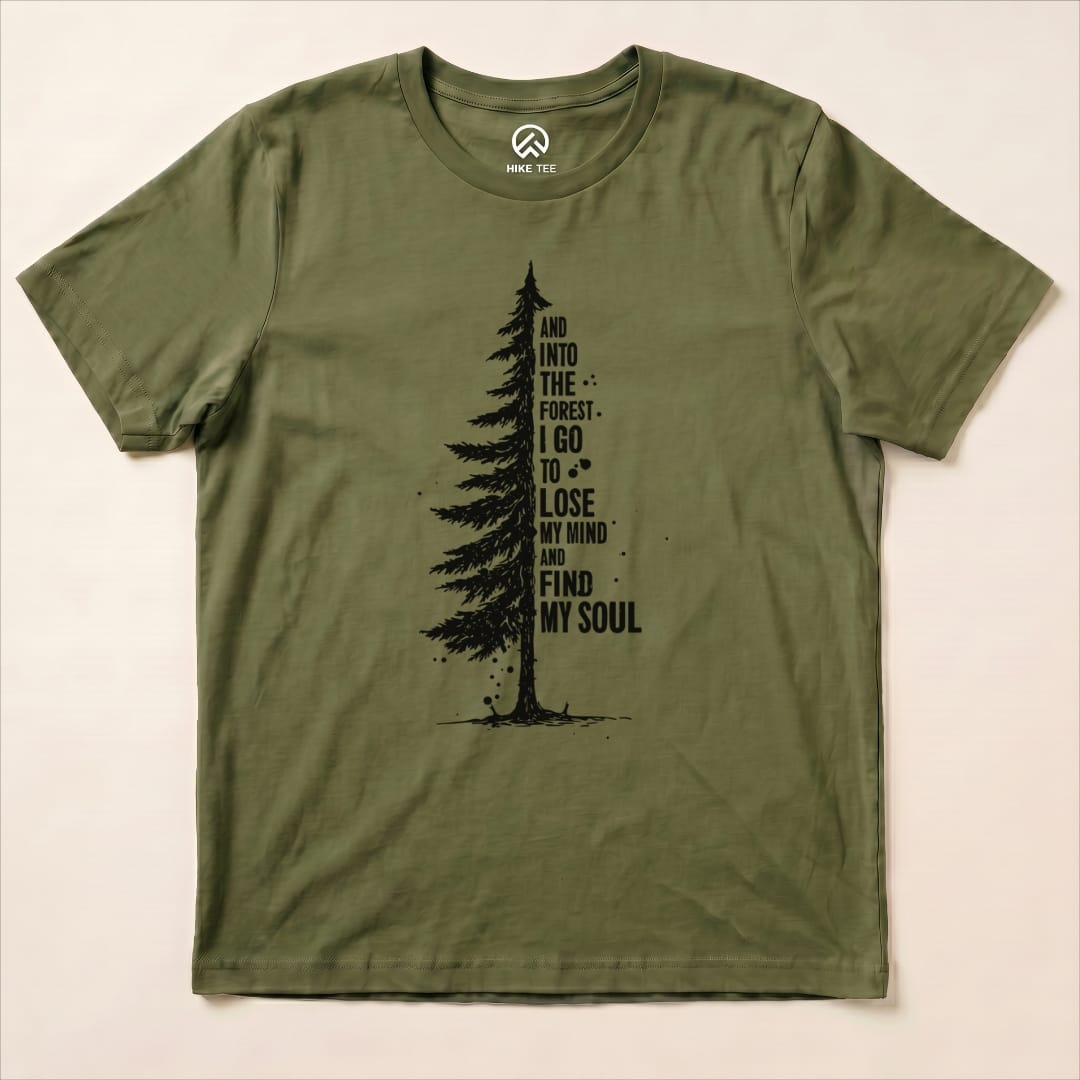 The graphic t-shirt features an illustration of a tall tree with the words "And into the forest I go to lose my mind and find my soul," labeled as the "In The Forest Shirt.