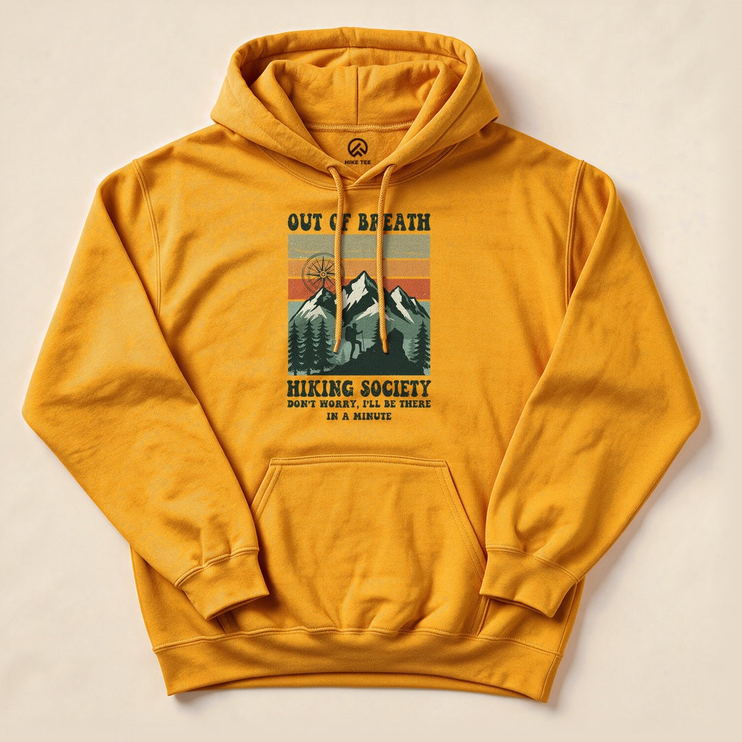 Gold Out of Breath Hiking Society Hoodie with a vintage mountain badge