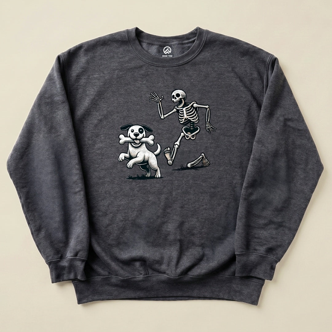 Graphic sweatshirt featuring a humorous design of a skeleton running playfully alongside a dog with a bone, titled "Skeleton and Dog Halloween Sweatshirt.