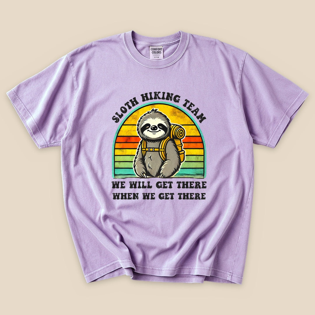Orchid Sloth Hiking Team T-Shirt with a backpacking sloth and retro sunset stripes graphic