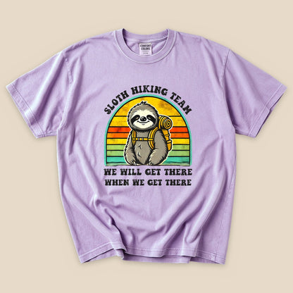 Orchid Sloth Hiking Team T-Shirt with a backpacking sloth and retro sunset stripes graphic