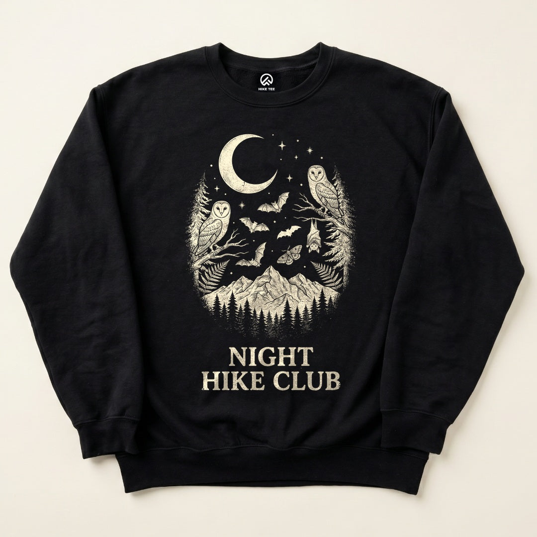 Black Night Hike Club Sweatshirt with owls, bats and a crescent moon over the mountains graphic