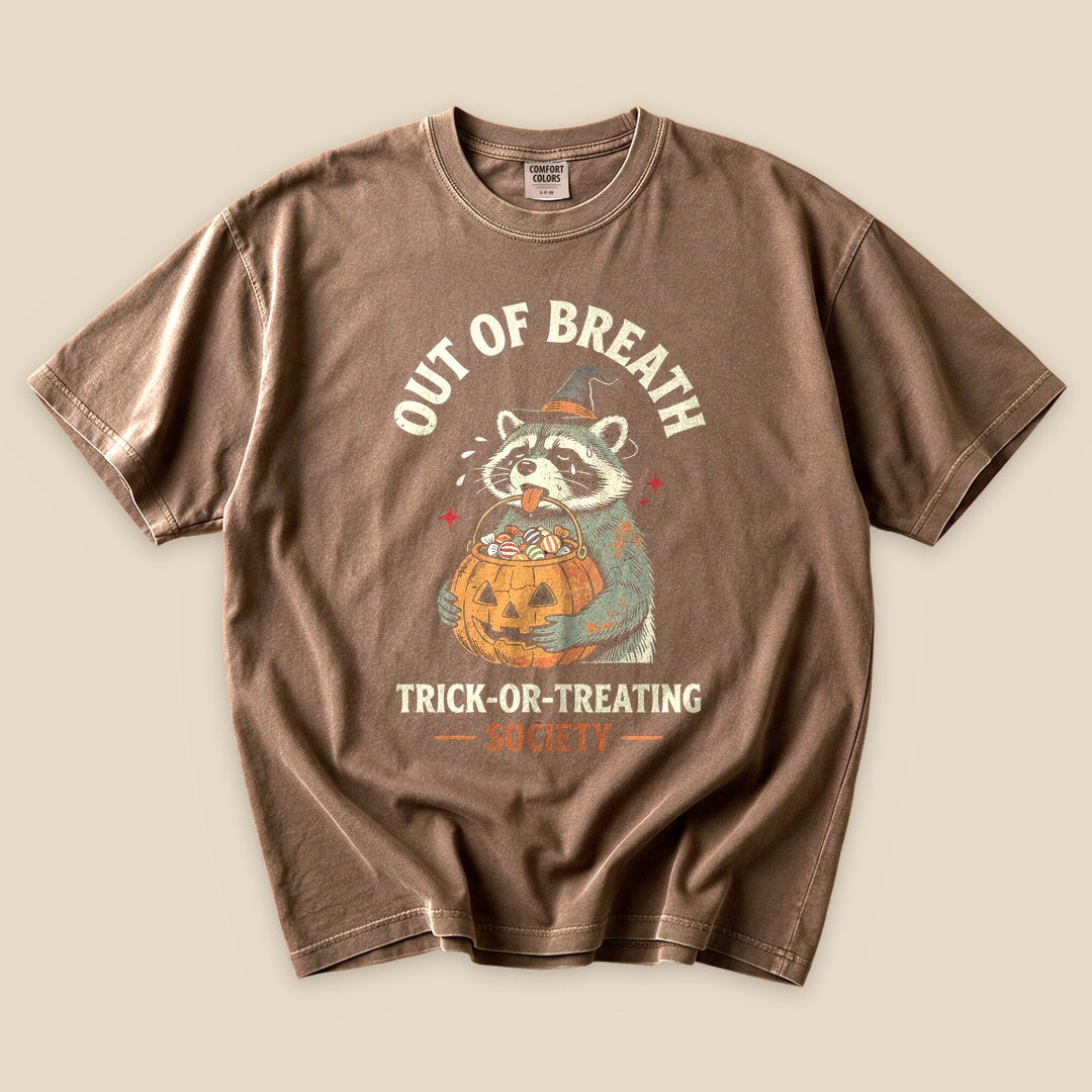 Espresso Out of Breath Trick-or-Treating Society T-Shirt with a raccoon with a jack-o'-lantern trick-or-treating graphic
