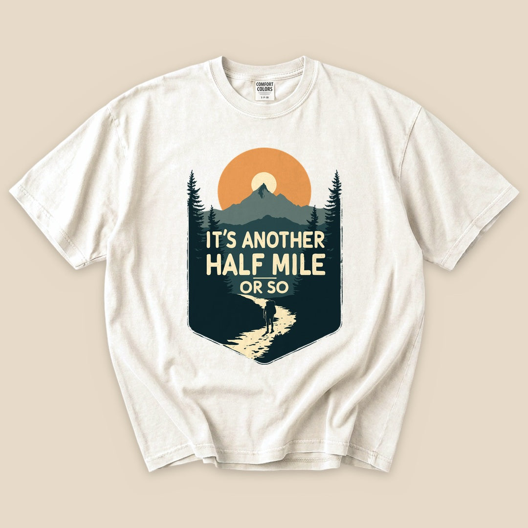 Ivory Half Mile T-Shirt with an It's Another Half Mile or So mountain hiker graphic