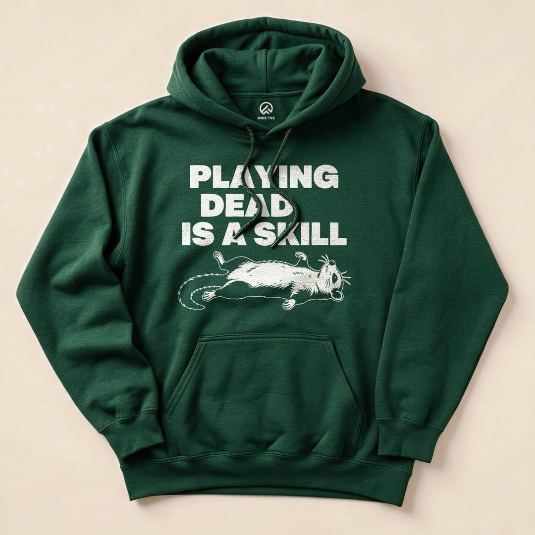 Forest Green Playing Dead Possum Hoodie with a possum playing dead graphic