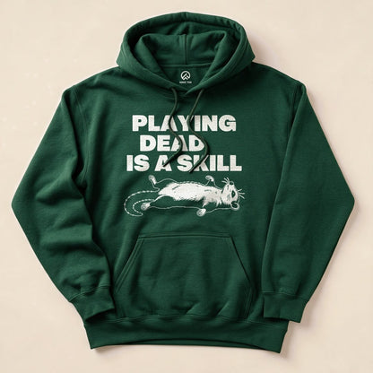 Forest Green Playing Dead Possum Hoodie with a possum playing dead graphic