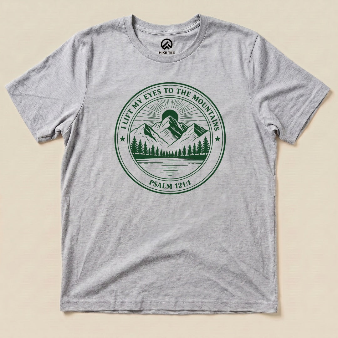 Athletic Heather I Lift My Eyes to the Mountains Shirt with a mountain lake badge with Psalm 121:1 graphic