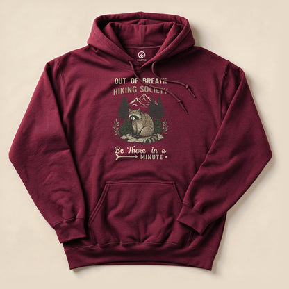 Maroon Out of Breath Hiking Society Raccoon Hoodie with a funny raccoon hiking graphic
