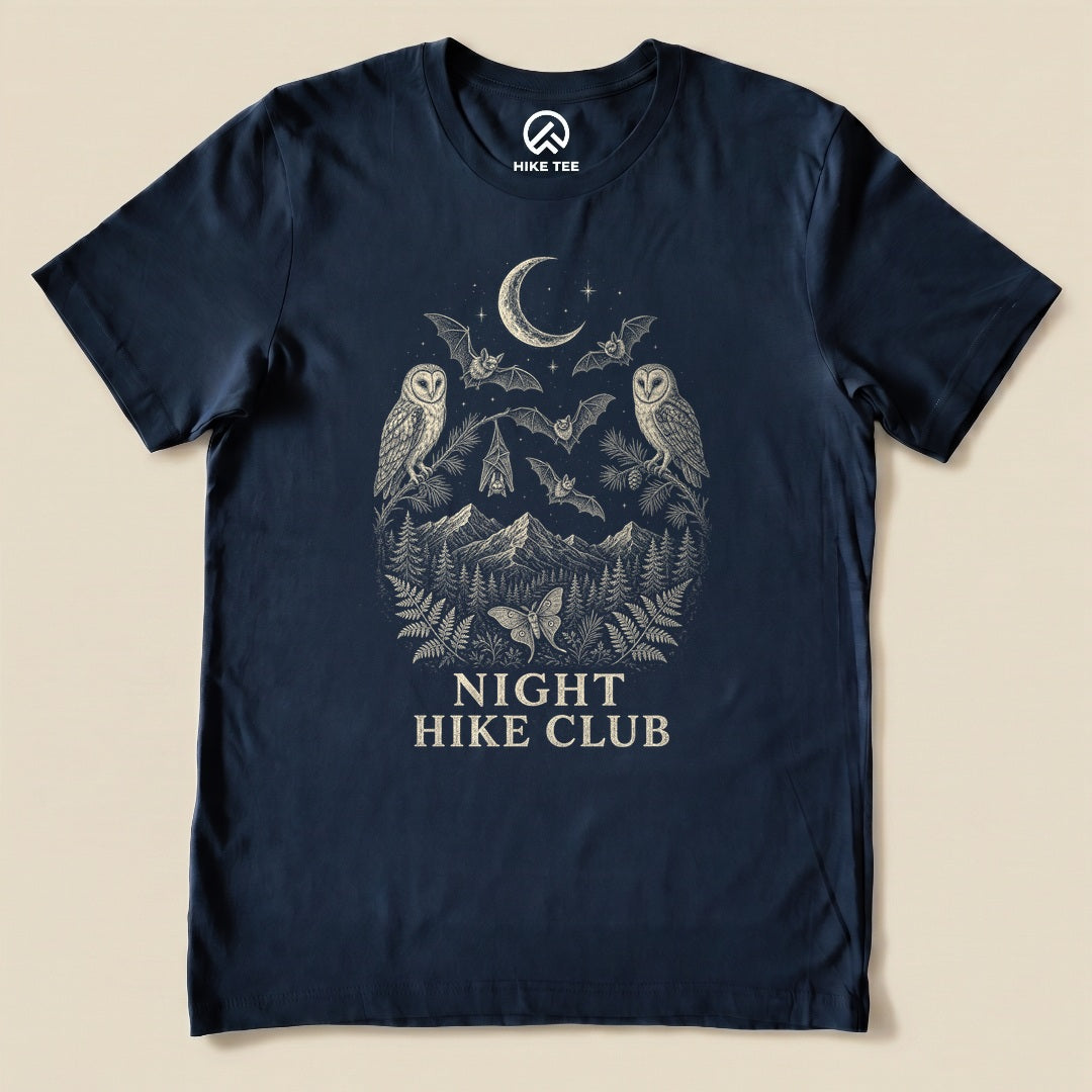 Navy Night Hike Club Engraved Shirt with a night forest scene with a moon, owls, moths and mountains in engraved style graphic