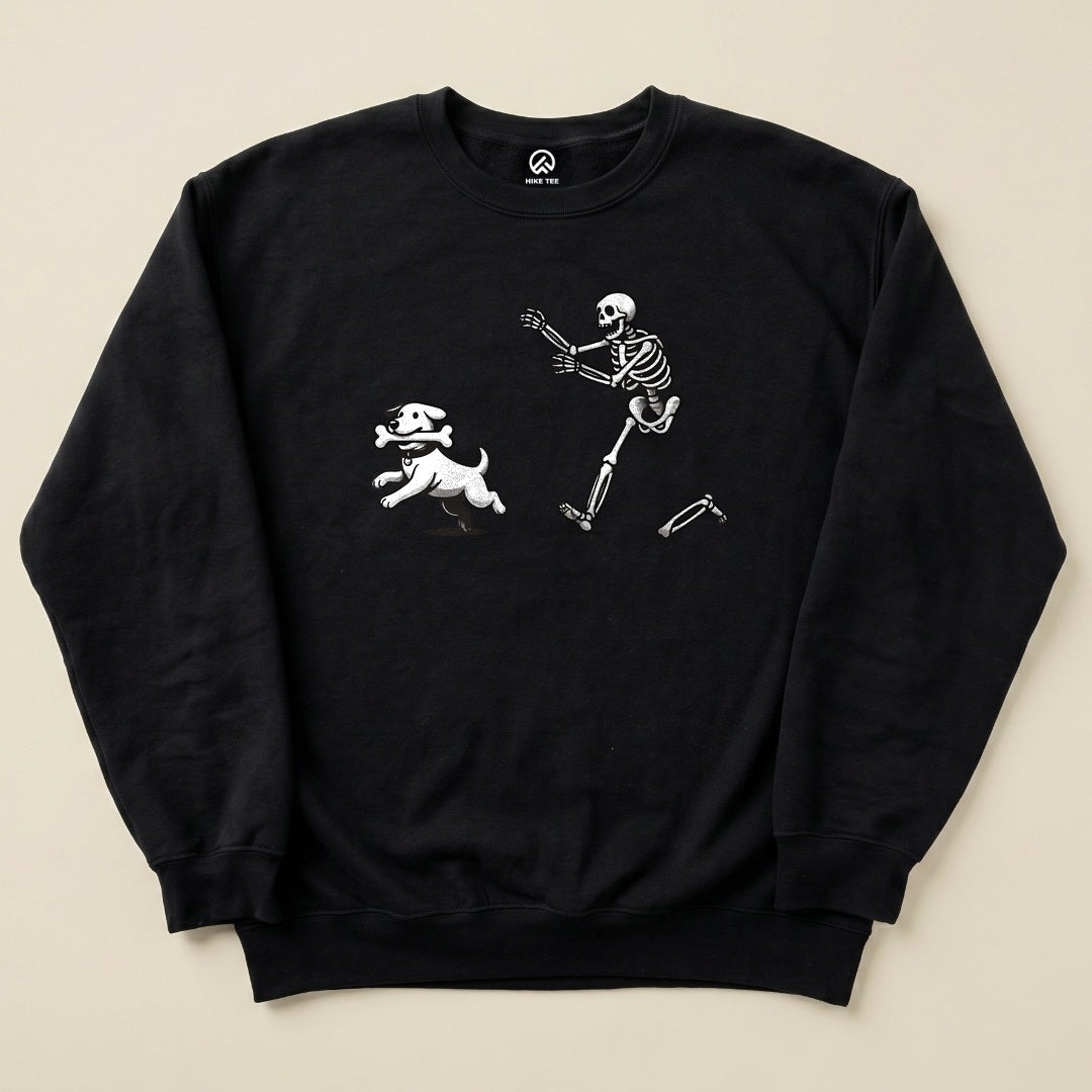 A black Skeleton and Dog Sweatshirt featuring a playful graphic of a skeleton running alongside a dog.