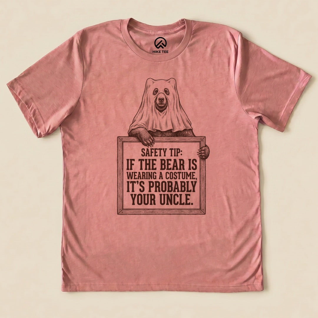 Heather Mauve Bear Safety Tip Shirt with a bear in a ghost sheet holding a safety tip sign graphic