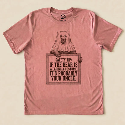 Heather Mauve Bear Safety Tip Shirt with a bear in a ghost sheet holding a safety tip sign graphic