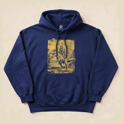 Navy blue hoodie featuring a graphic of a Bigfoot riding a dinosaur, surrounded by a forest scene in yellow.