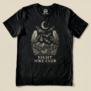 Black Night Hike Club Engraved Shirt with a night forest scene with a moon, owls, moths and mountains in engraved style graphic