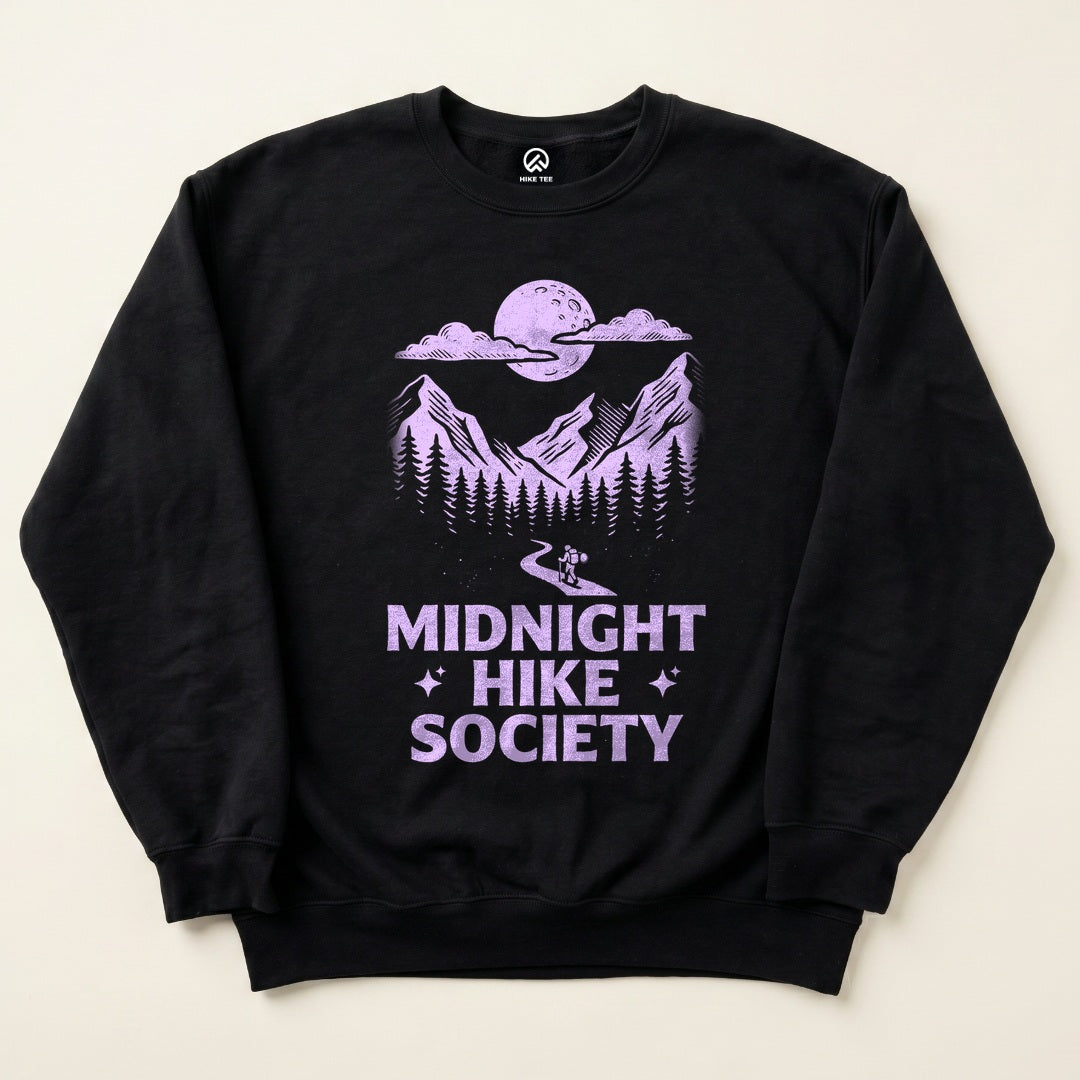 Black Midnight Hike Society Sweatshirt with a full moon over the mountains and a night hiker graphic