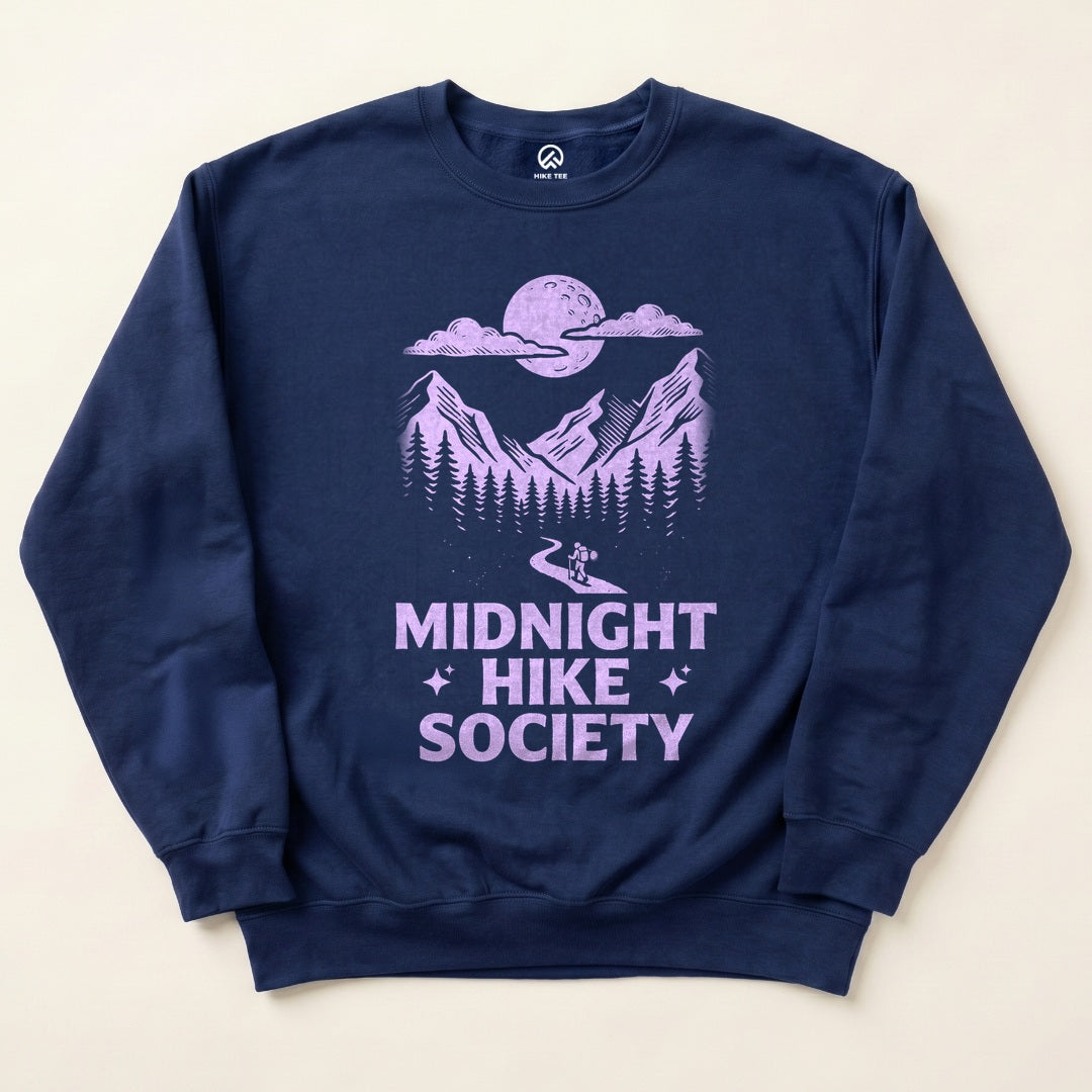 Navy Midnight Hike Society Sweatshirt with a full moon over the mountains and a night hiker graphic