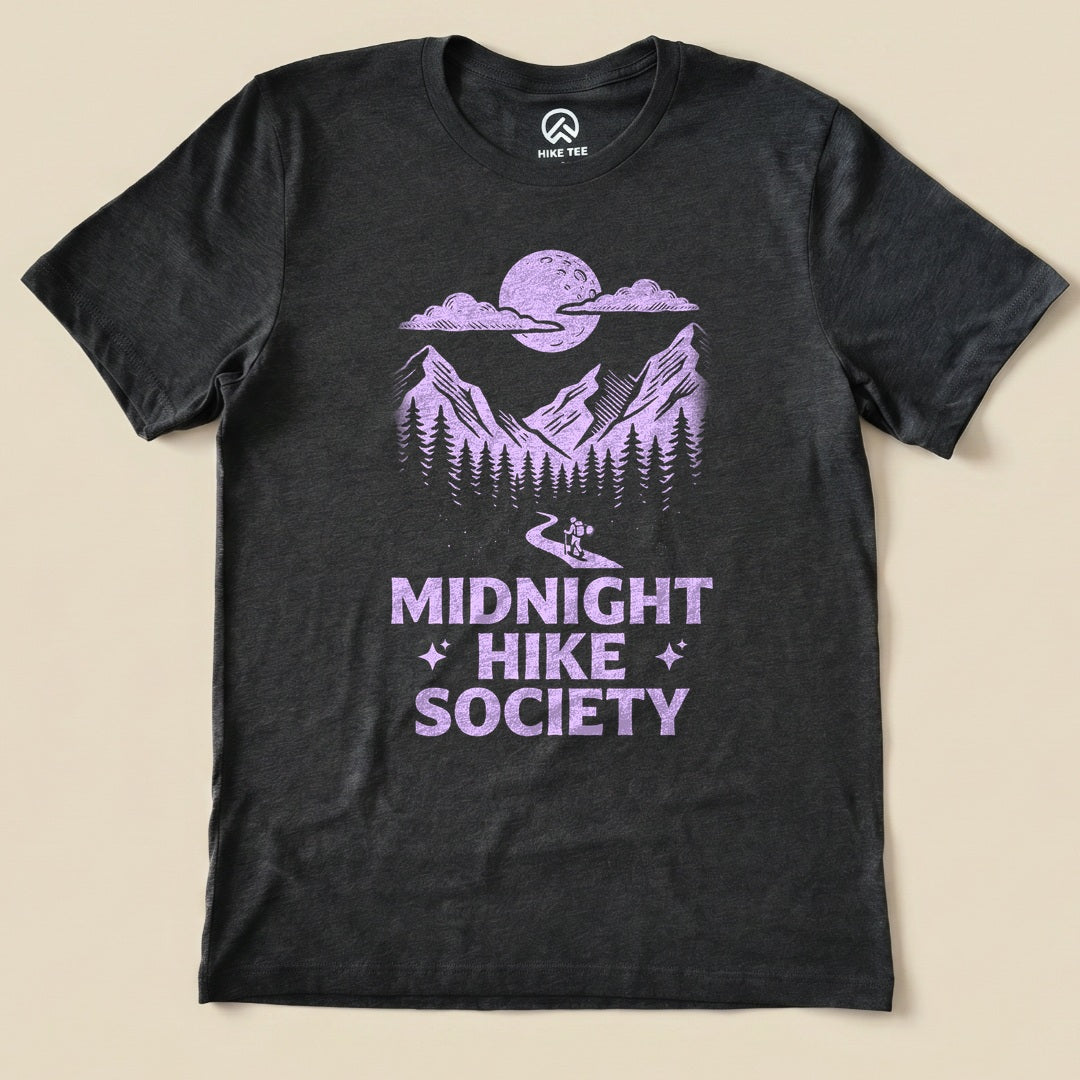 Dark Grey Heather Midnight Hike Society Shirt with a moonlit mountain scene with a night hiker graphic