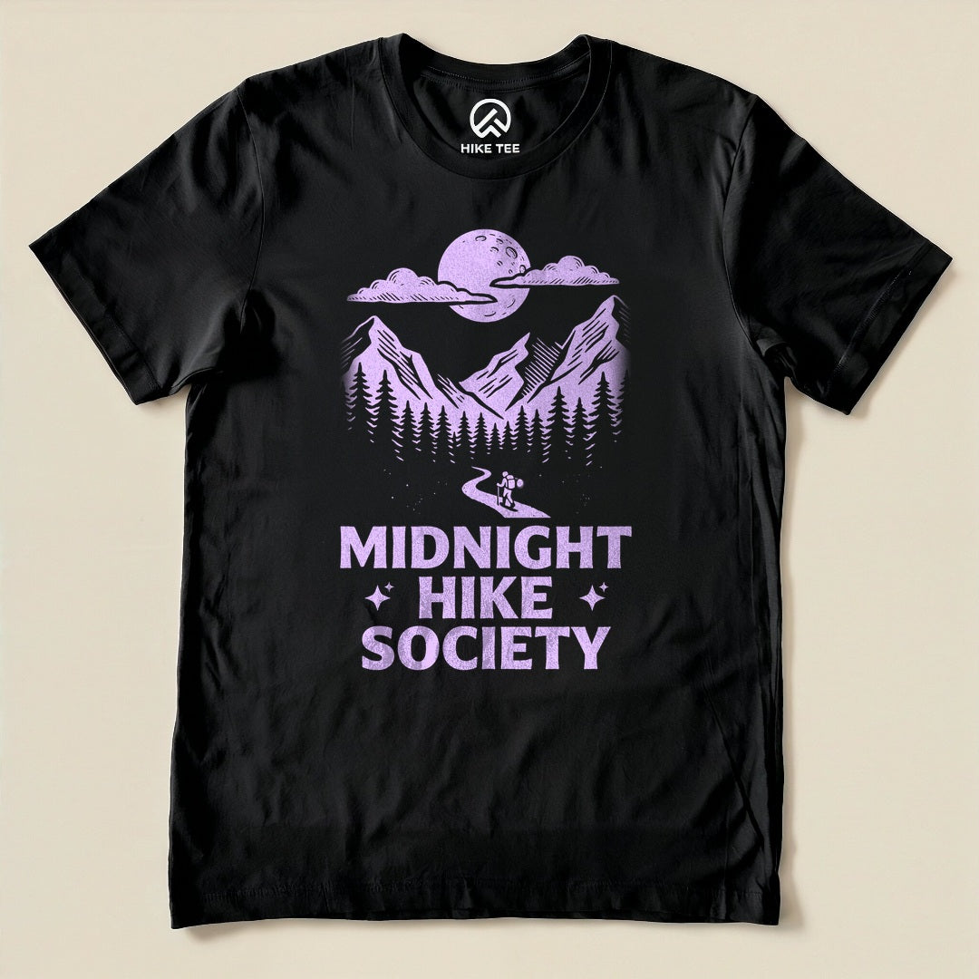 Black Midnight Hike Society Shirt with a moonlit mountain scene with a night hiker graphic