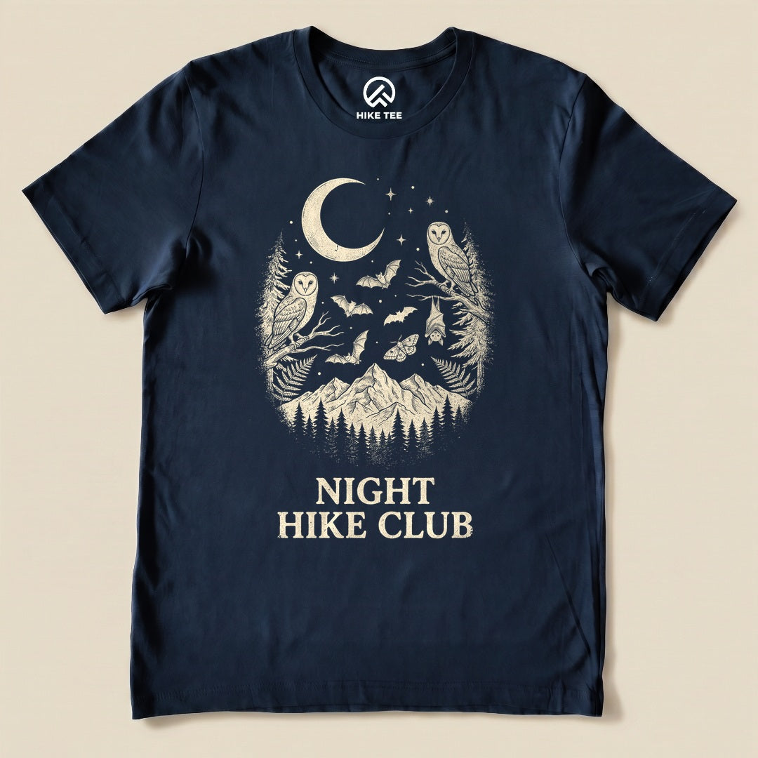 Navy Night Hike Club Shirt with a crescent moon, owls, bats and mountains graphic