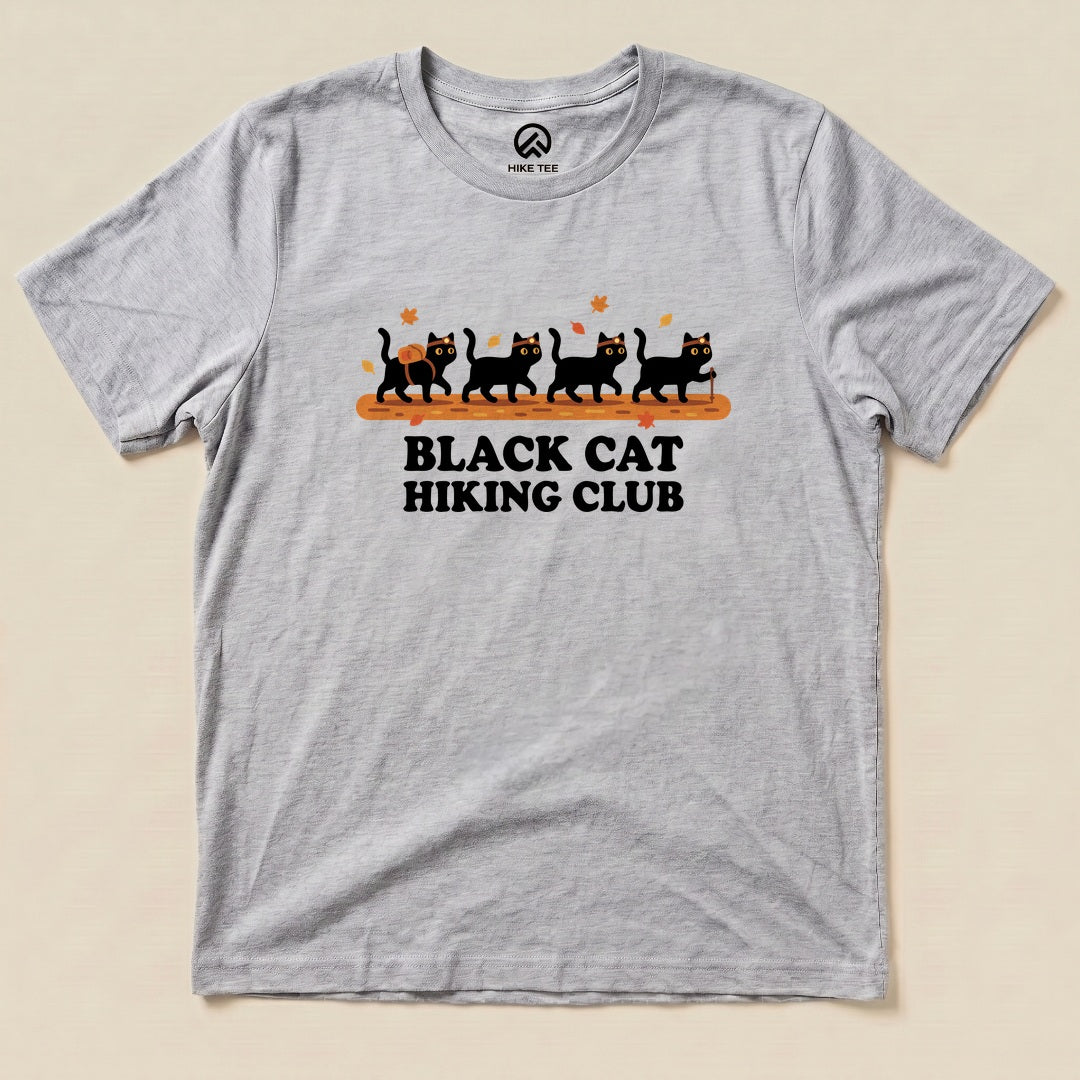 Athletic Heather Black Cat Hiking Club Shirt with a row of black cats walking on a log with autumn leaves graphic