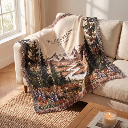Mountain River Wildflower Woven Blanket draped over a sofa corner
