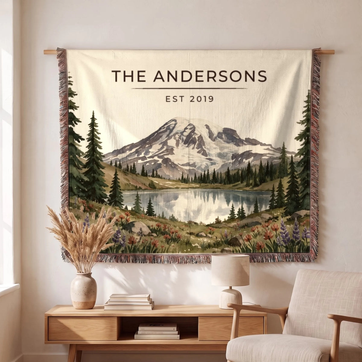 Personalized Mount Rainier Lake Woven Blanket hanging on a wall, family name woven in