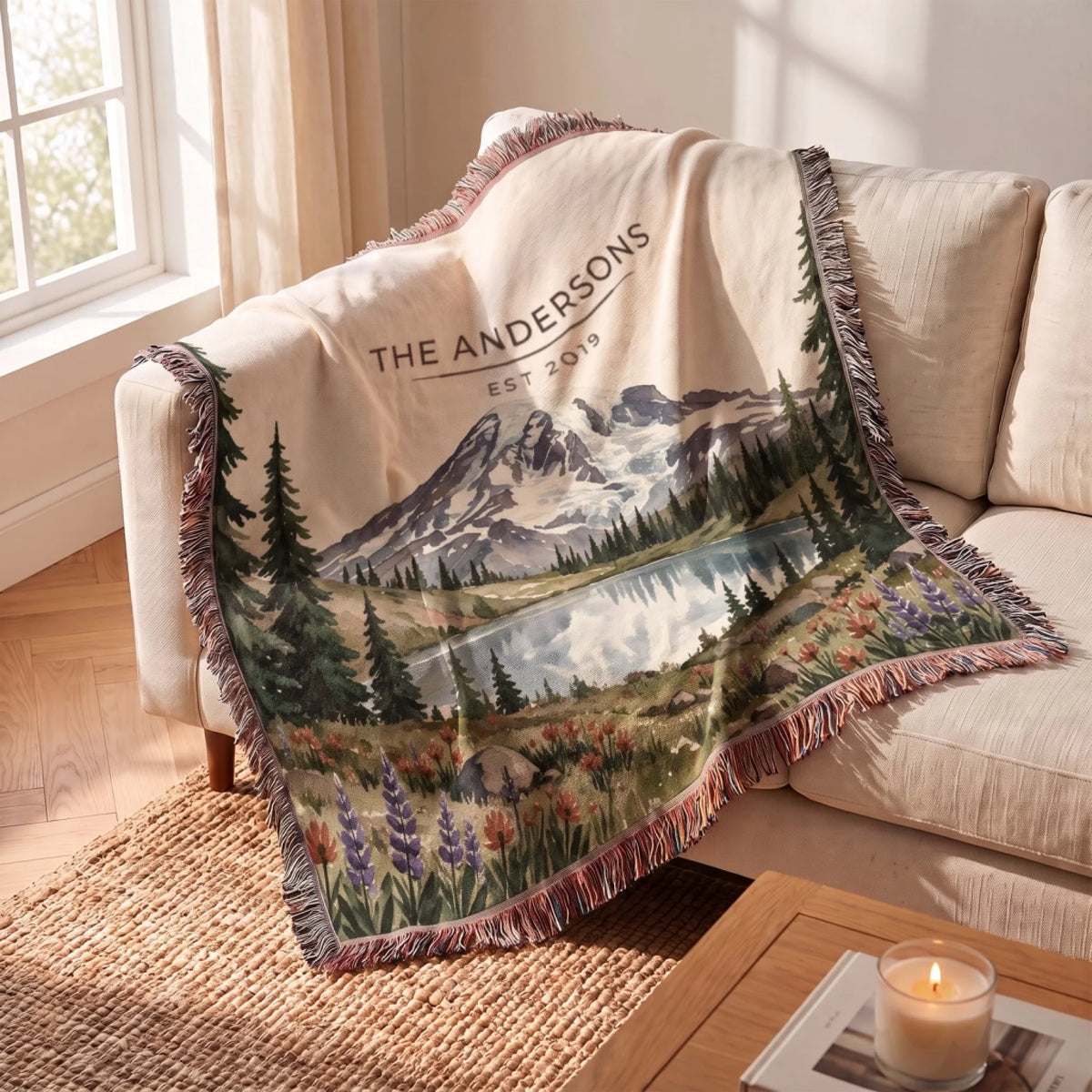 Mount Rainier Lake Woven Blanket draped over a sofa