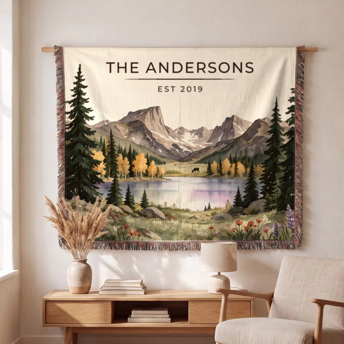 Personalized Rocky Mountain Lake Elk Woven Blanket hanging on a wall, family name woven in