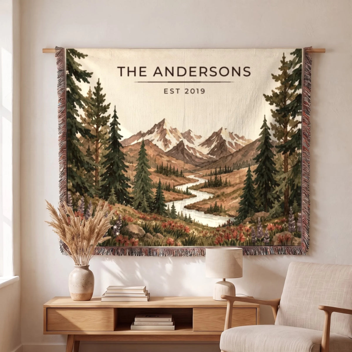 Couple wrapped in the Rocky Mountain Lake Elk Woven Blanket by a campfire