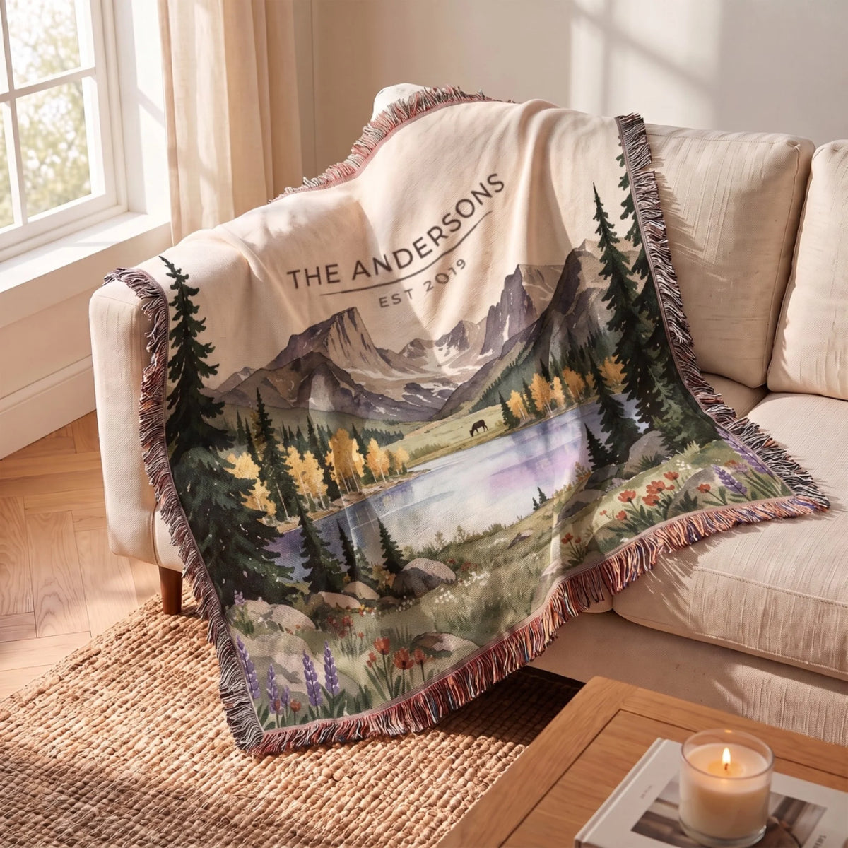 Rocky Mountain Lake Elk Woven Blanket draped over a sofa