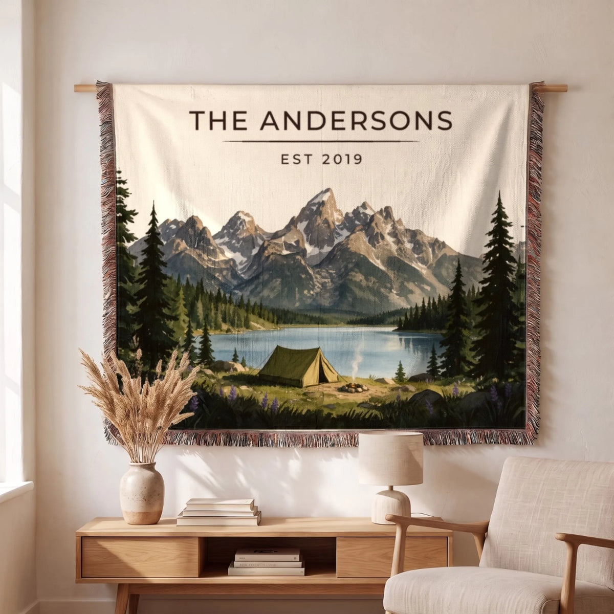 Personalized Grand Teton Lake Campsite Woven Blanket hanging on a wall, family name woven in