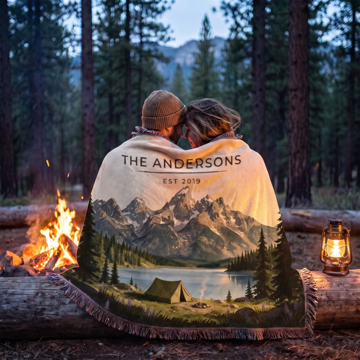 Couple wrapped in the Grand Teton Lake Campsite Woven Blanket by a campfire