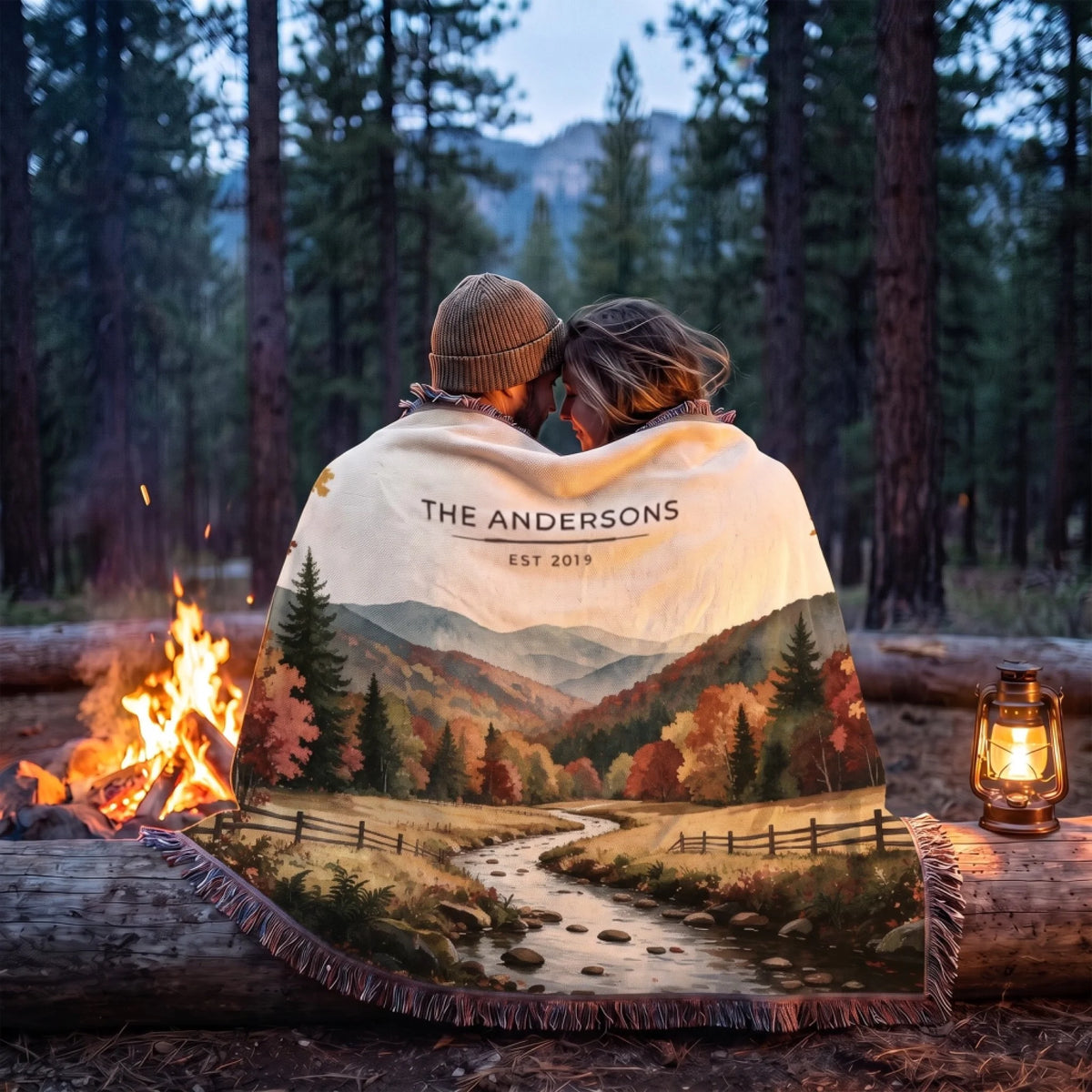 Couple wrapped in the Great Smoky Mountains Autumn Woven Blanket by a campfire