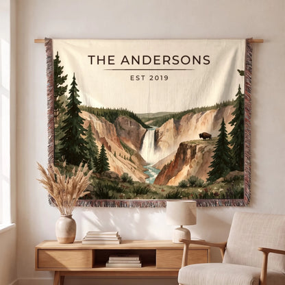 Personalized Yellowstone Falls Bison Woven Blanket hanging on a wall, family name woven in