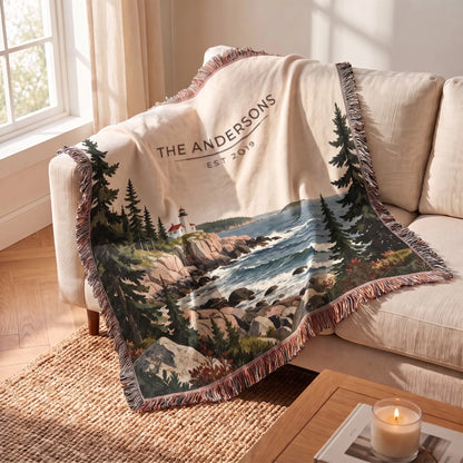 Acadia Lighthouse Coast Woven Blanket draped over a sofa