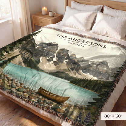 Glacier Lake Canoe Woven Blanket 80x60 on a queen bed