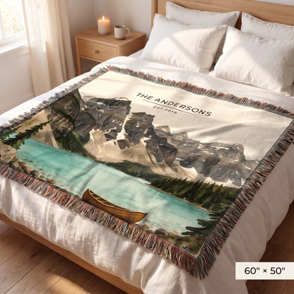 Glacier Lake Canoe Woven Blanket 60x50 on a queen bed