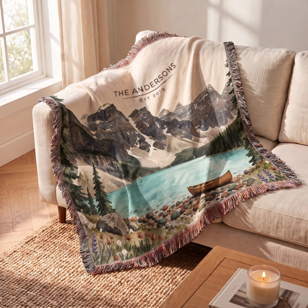 Glacier Lake Canoe Woven Blanket draped over a sofa