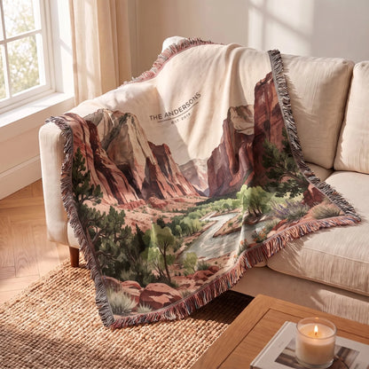 Zion Canyon River Woven Blanket draped over a sofa