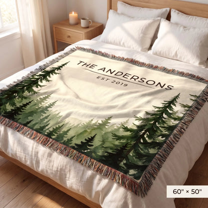 Evergreen Forest Treetops Woven Blanket 60x50 on a queen bed