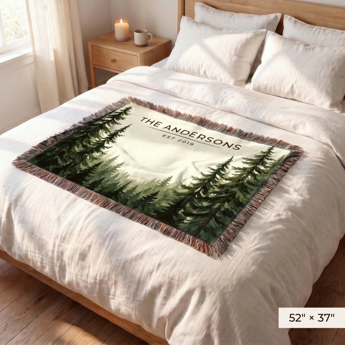 Evergreen Forest Treetops Woven Blanket 52x37 on a queen bed