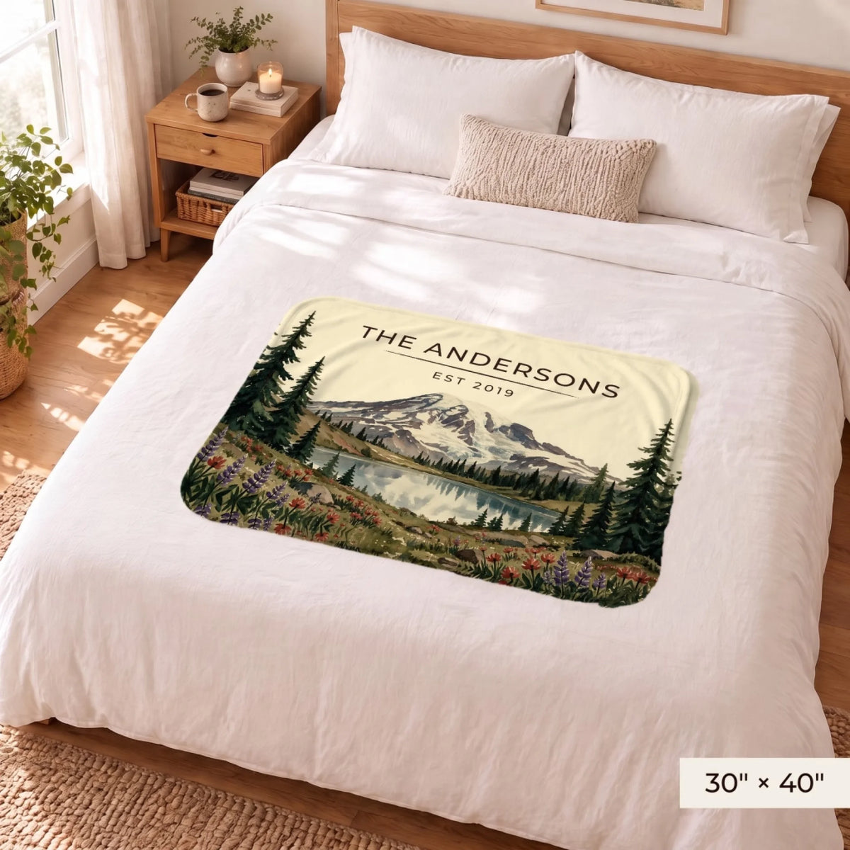 Mount Rainier Lake Sherpa Blanket 30x40 on a queen bed