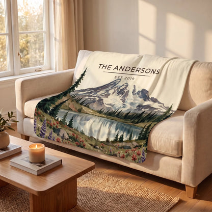 Mount Rainier Lake Sherpa Blanket draped over a sofa