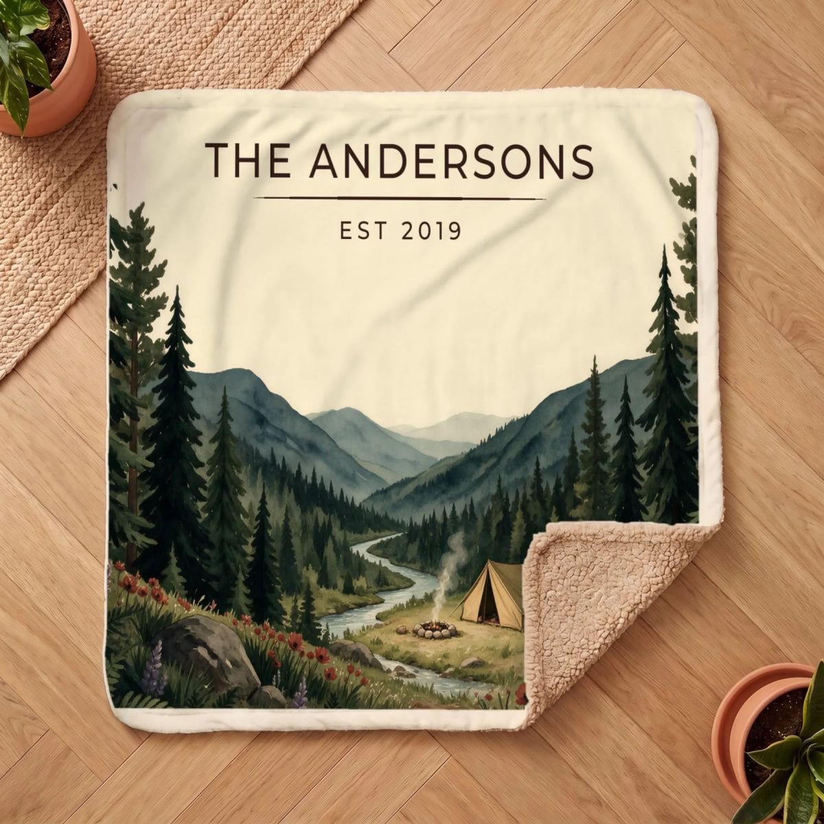 Personalized Forest Campsite Sherpa Blanket on a wooden floor with the cozy sherpa back showing