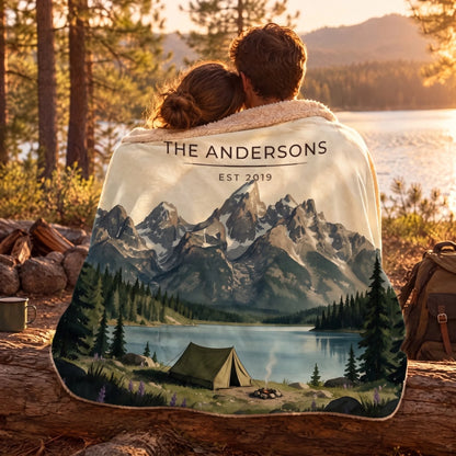 Couple wrapped in the Grand Teton Lake Campsite Sherpa Blanket by a lake
