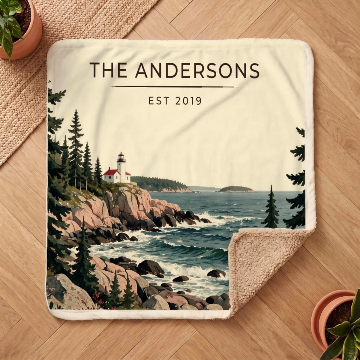 Personalized Acadia Lighthouse Coast Sherpa Blanket on a wooden floor with the cozy sherpa back showing