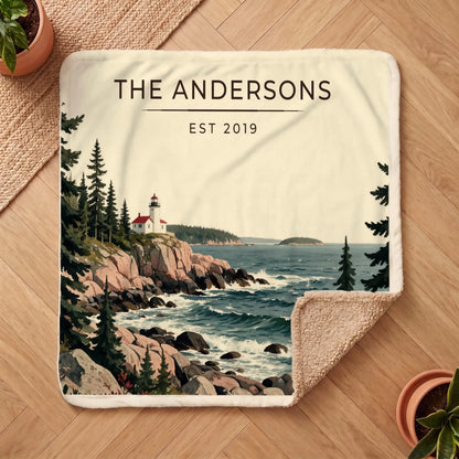 Personalized Acadia Lighthouse Coast Sherpa Blanket on a wooden floor with the cozy sherpa back showing