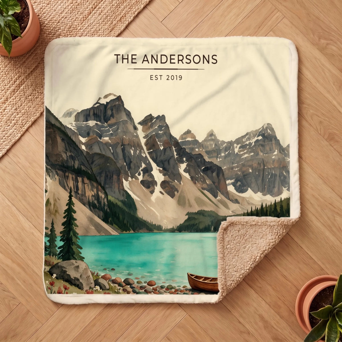 Personalized Glacier Lake Canoe Sherpa Blanket on a wooden floor with the cozy sherpa back showing