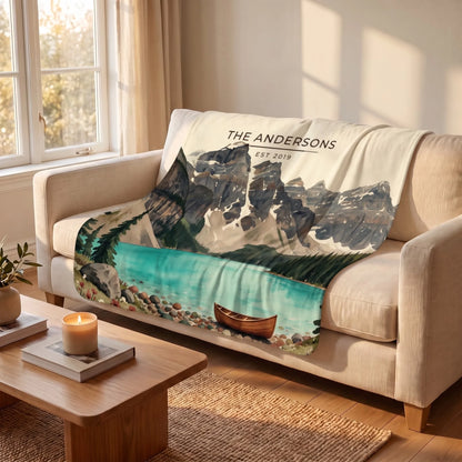 Glacier Lake Canoe Sherpa Blanket draped over a sofa